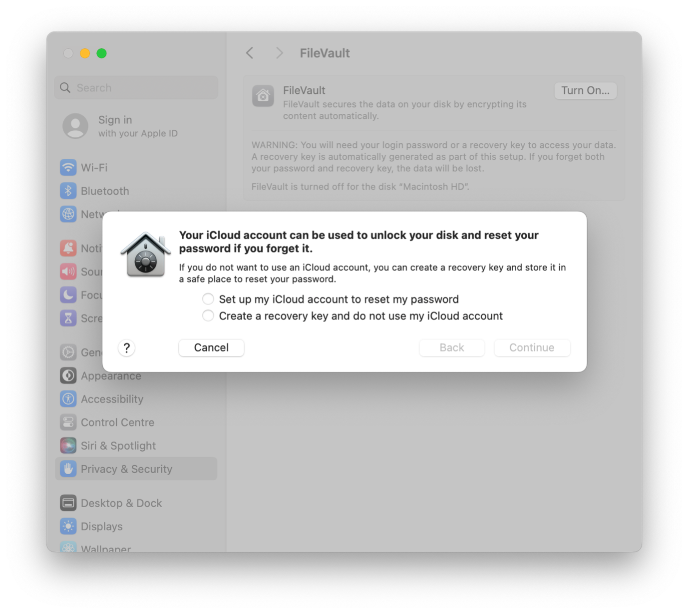 The recovery key dialogue box that appears when you turn on FileVault. It gives you the option to set up your iCloud account to reset your computer login password or to create a recovery key you can use to reset your password.
