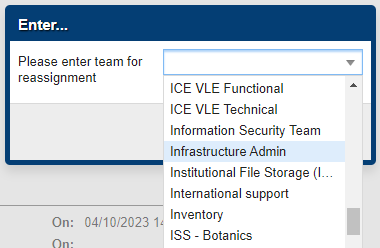 Dialogue box with the text 'Please enter team for reassignment and a dropdown menu with 'Infrastructure Admin' selected